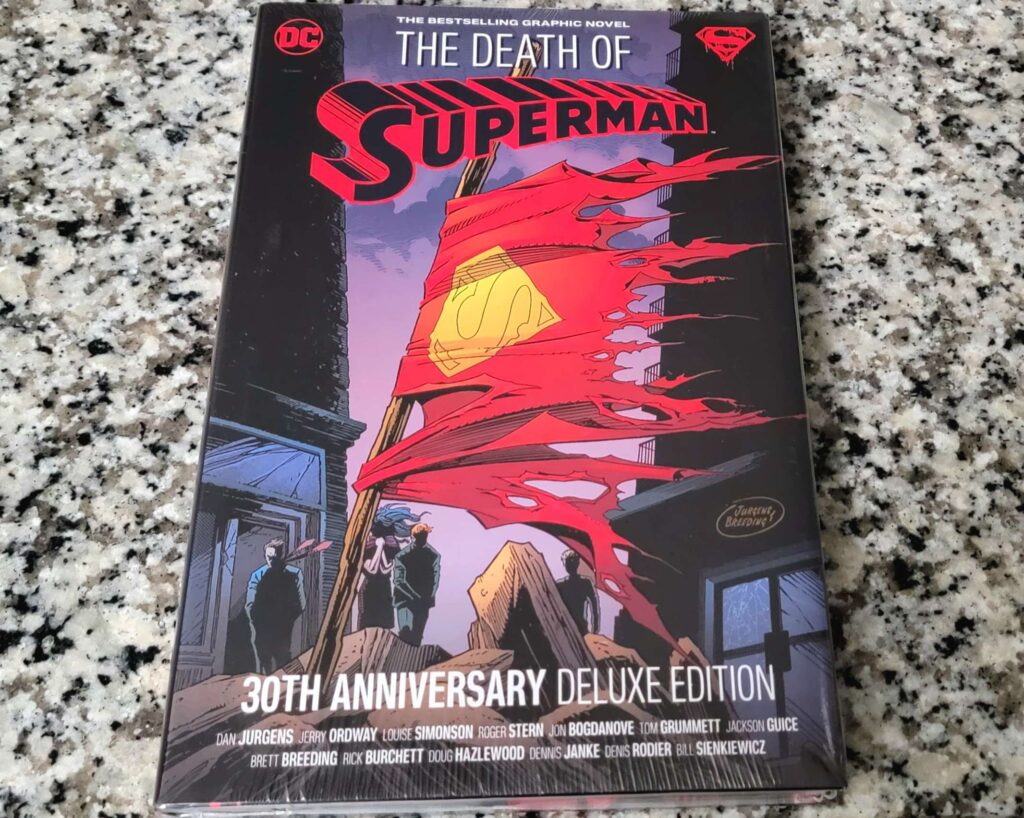 The image is of the cover of the Death of Superman special edition. On the cover is Superman's death flag made from his torn cape. 